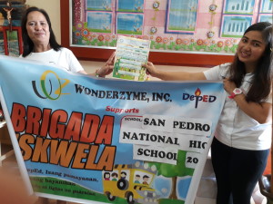 Another photo of San Pedro National High’s Principal, issuing the certificate of appreciation to our AE.